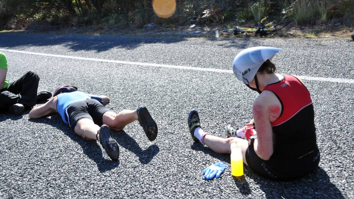 Ouch: Two competitors in Sunday's Ironman Port Macquarie 70.3 after an accident along Ocean Drive.