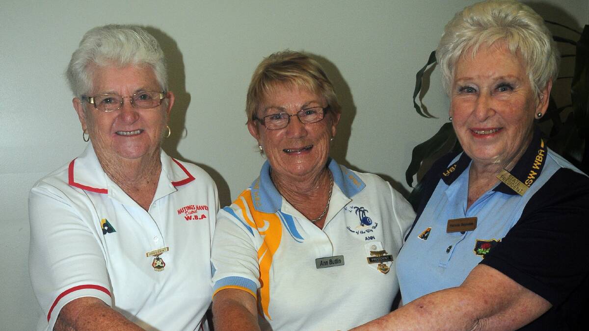 Cutting the cake: From left, Hastings Haven district president Maureen Bradford, Lake Cathie Bowling Club president Ann Butlin and state bowls president Patricia Reynolds.