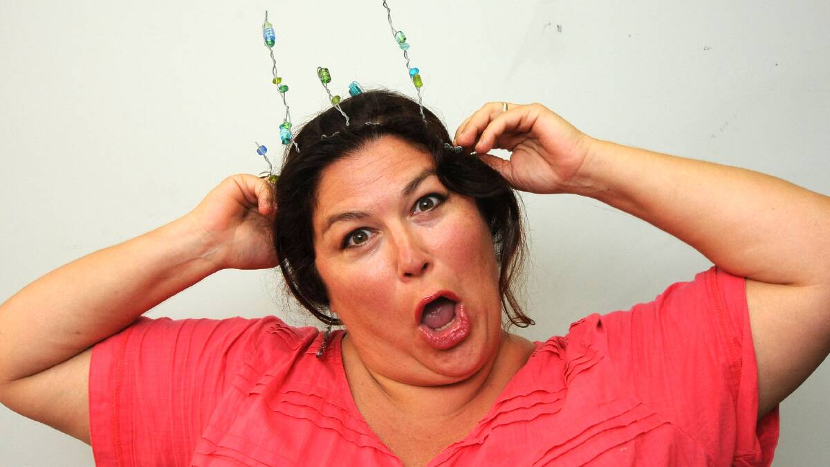 Funny lady: Claudia Giblin-Smith dons  her crown of happiness.