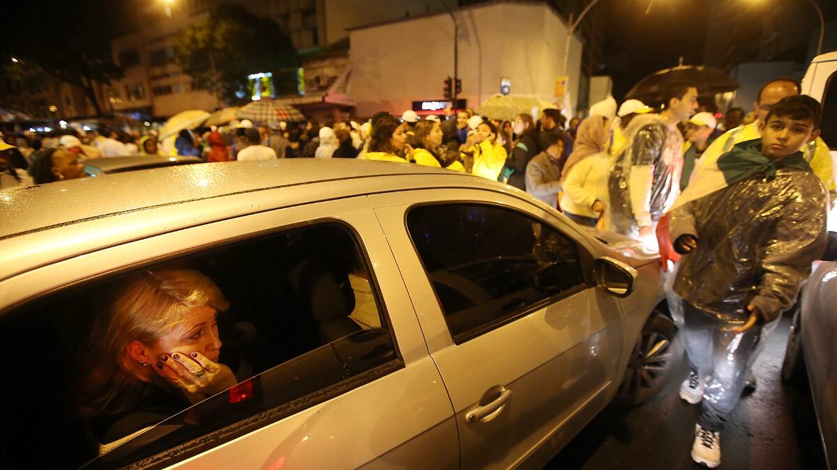 People crowd the streets blocking traffic following Pope Francis' Mass on Copacabana Beach on July 25. Photo: Getty Images