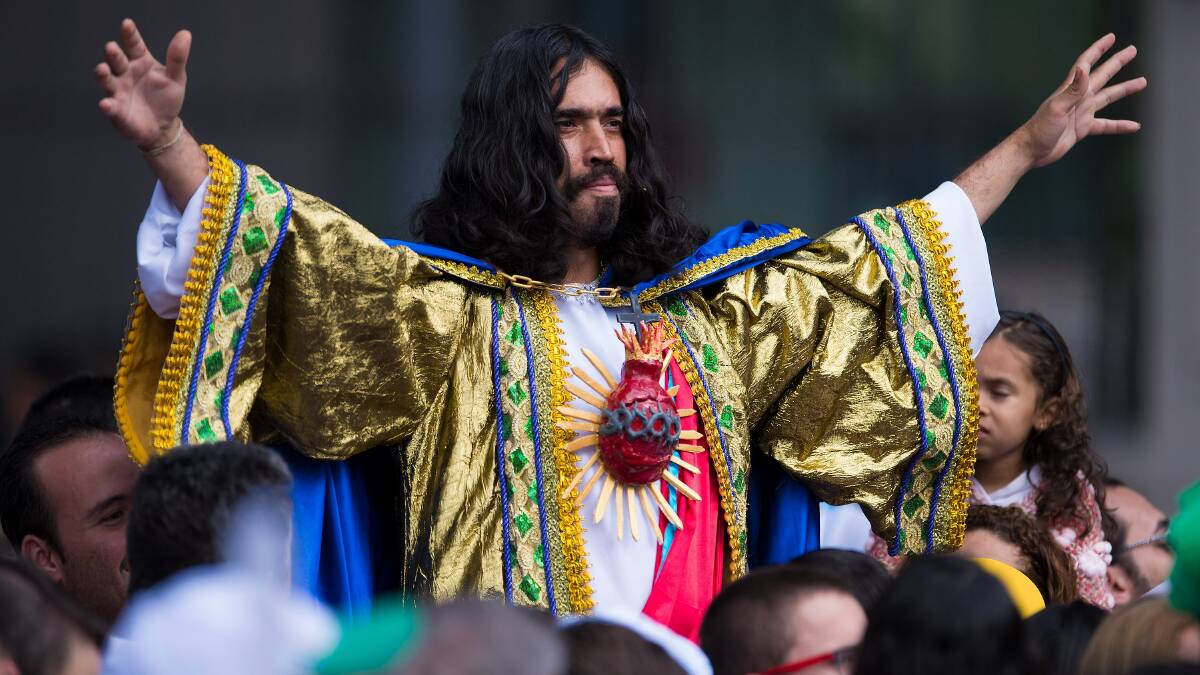 A man dressed as Jesus Christ is seen among the crowd gathering outside the San Joaquin Episcopal Palace before Pope Francis delivers the Angelus prayer on July 26, 2013 in Rio de Janeiro, Brazil. Photo: Getty Images