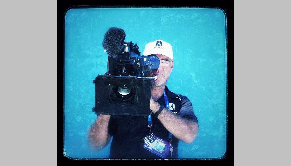 A seven network cameraman, 36, from Melbourne attends the 2013 Australian Open. Photo by Marianna Massey/Getty Images