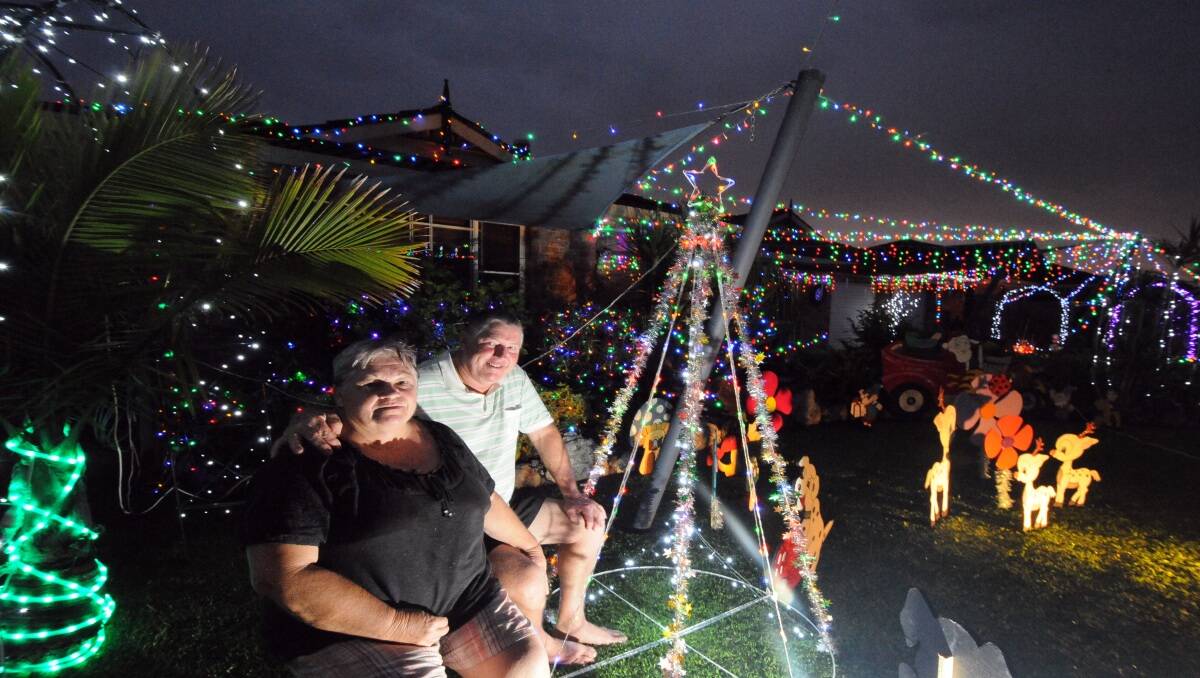  Twinkle, twinkle: Les and Denise Graham take great pleasure in providing a brilliant Christmas lights display at their Newmarket Grove home