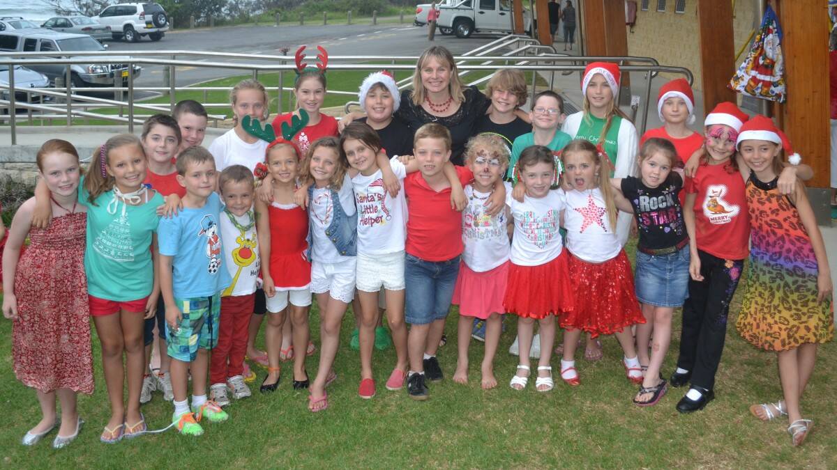 St Joseph's Primary School Choir have a group hug before performing at carols on the deck. Photo:The Camden Haven Courier.