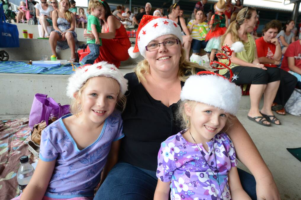  At Old Bar's Carols by Candlelight, Allana Hancock with Tilly and Samantha Hollis. Photo:The Manning River Times.