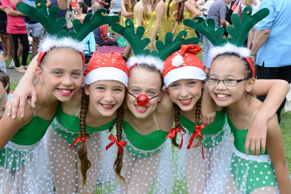 Nathalie Dogle, Kalani Cross, Zoe O'Bryan, Bonnie Grice and Grace Cai at the Taree Carols by Candlelight.Photo:The Manning River Times.