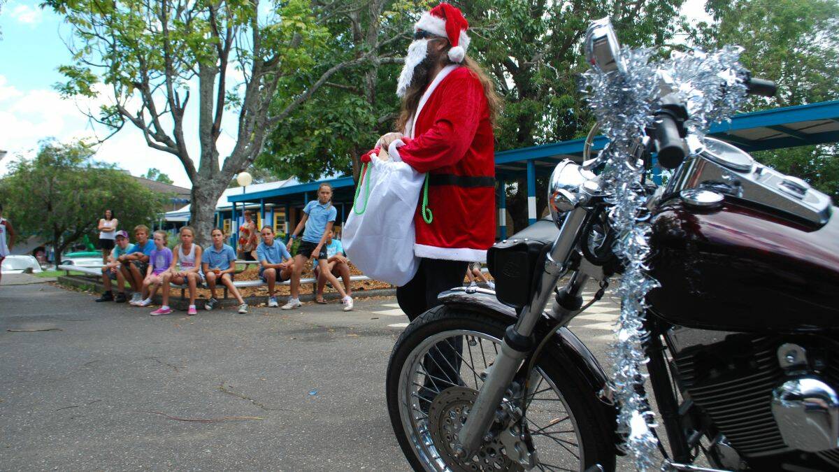  Santa arrived on his Harley Davidson at Kempsey West Public School on December 18 and surprised local children. Photo:The Macleay Argus.
