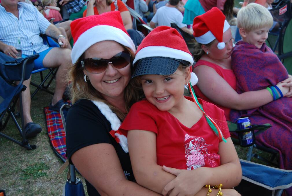 Clary and Krysten Foster at the Rotary Club of Tuncurry-Forster's 39th annual Carols by Candlelight at John Wright Park.  Photo:The Great Lakes Advocate.
