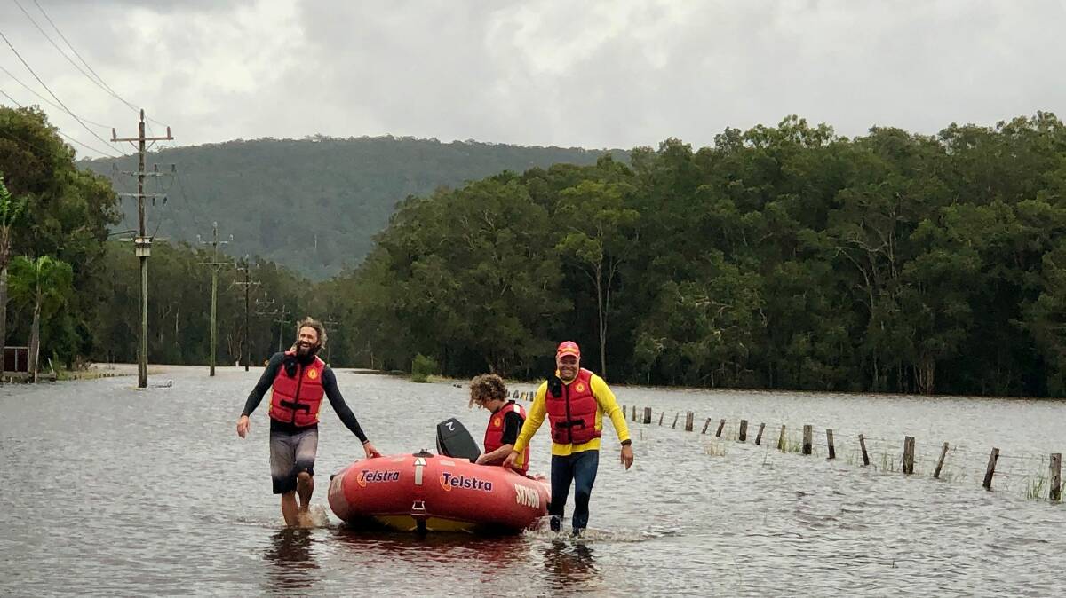 Surf club volunteers help ferry people, medical supplies and food to isolated towns. Photo: Samantha Townsend