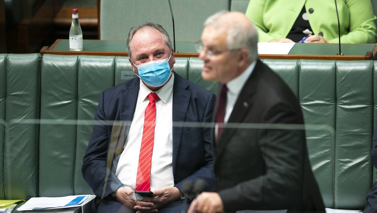 Deputy Prime Minister Barnaby Joyce watches Prime Minister Scott Morrison at the despatch box. Picture: Keegan Carroll