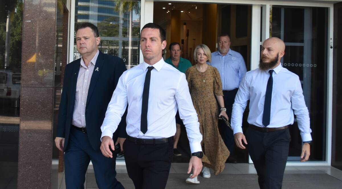Zachary Rolfe (centre) leaves the Darwin Supreme Court with NT Police Union president Paul McCue (left) and his parents (at rear). Picture: Sarah Matthews