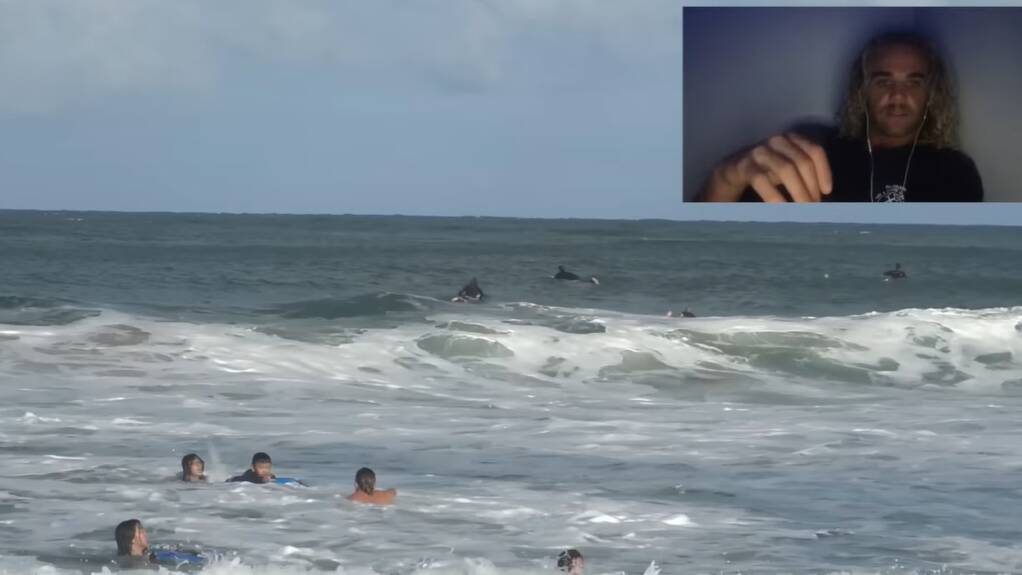 The video shows a young family struggling to swim back to shore before getting rescued by an off-duty lifeguard and a local surfer. 