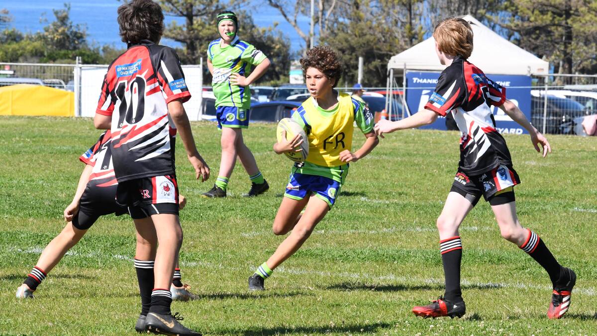 JJ Navosa runs the ball for Lake Cathie Bonny Hills under-12s in 2023. File picture
