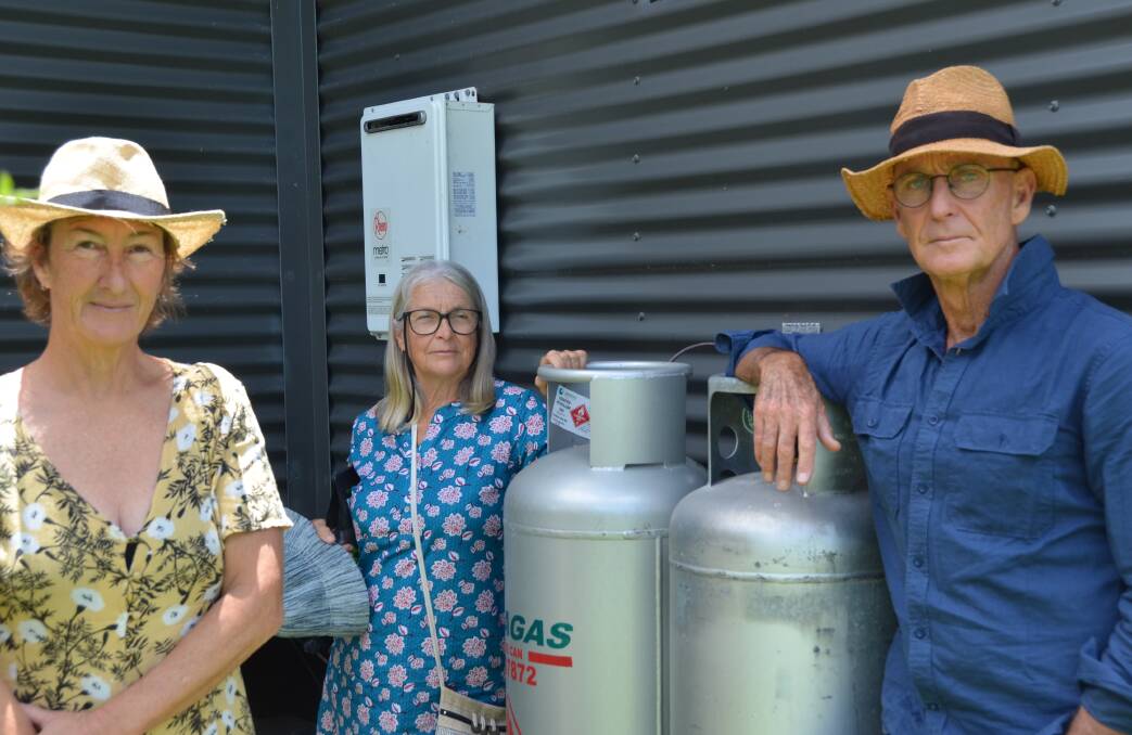Goolawah Co-operative residents Julica Jungehuelsing, Bronwyn Little and Peter O'Hara have now turned to Origin Energy as their supplier, but fear a similar situation could occur. Picture by Mardi Borg