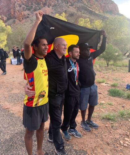 Charlie Maher with IMF founder Rob de Castella and Ethan Mulholland, Juan Darwin in Alice Springs. Picture supplied by IMF