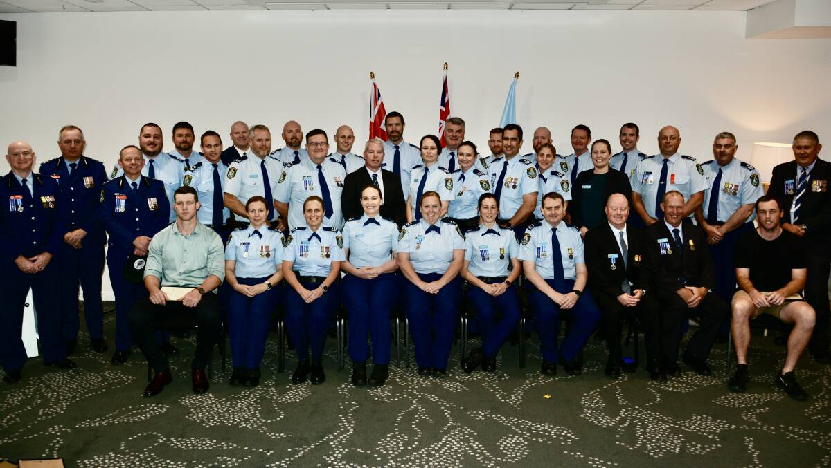 Police award recipients include Michael Foster (at back, seventh from left) who received his second Commissioner's Valour Award. Picture supplied/NSW Police