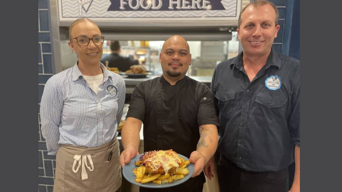 Settlers Inn bar attendant Nicole Greenaway, sous-chef Christian Enriquez and assistant manager Matt McComb are proud of the hotel's Best Parmi win at the AHA NSW Awards for Excellence. Picture by Lisa Tisdell