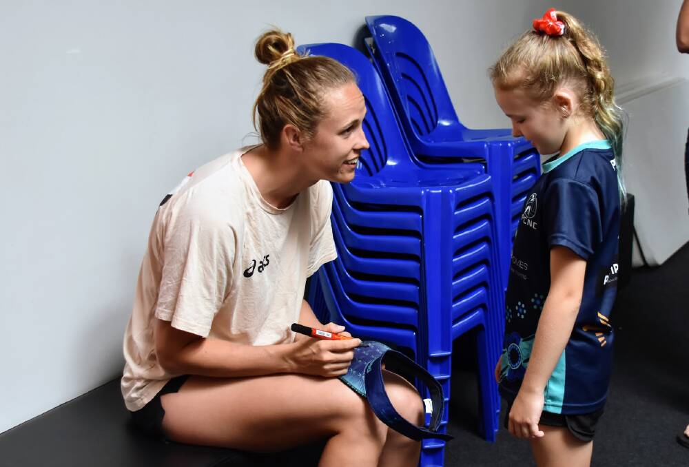 Layci Kearsey was one of the lucky netball players who met Swifts and Diamonds player Paige Hadley at the coaching clinics. Picture by Emily Walker
