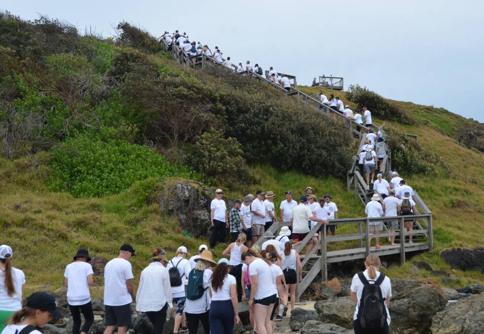 Participants for the Coastal Walk Against Domestic and Family Violence begin the 11 kilometre walk from Lighthouse Beach to Westport Park. Picture by Emily Walker