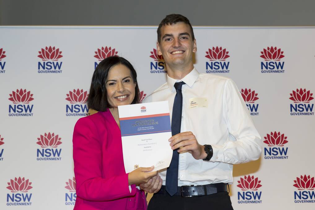 Jed Kirkman recieving his certficate from Deputy Premier Prue Car at the 2023 HSC First in Course ceremony. Picture by NSW Education Standards Authority