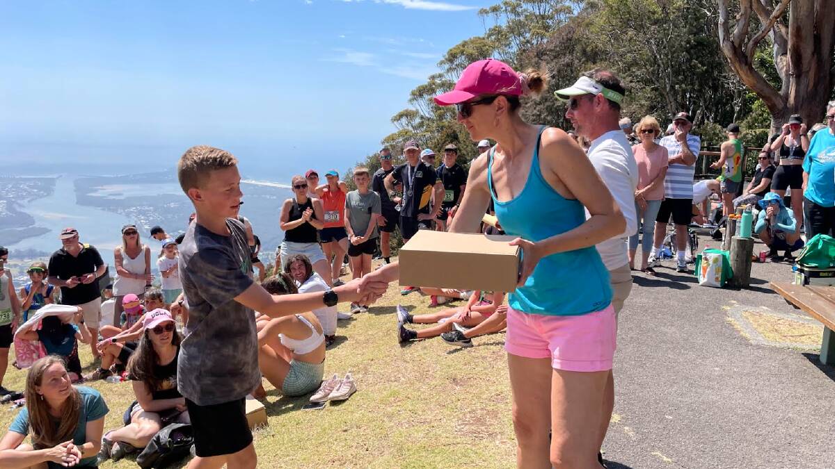 Port Macquarie local and 5km winner Trent Alley collects his first place prize. Picture supplied