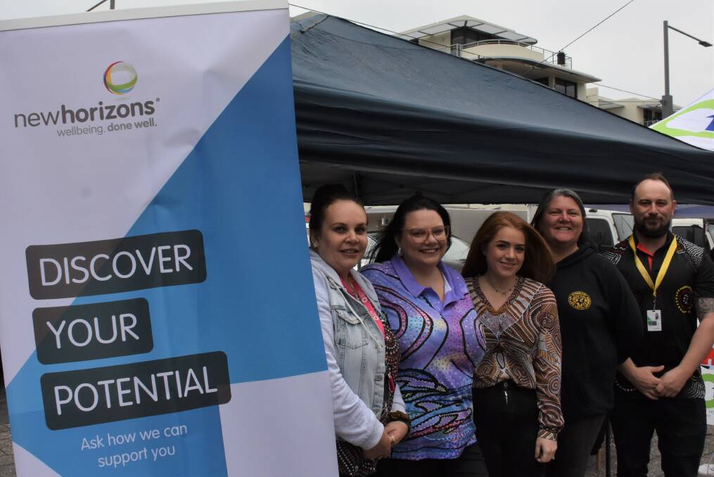Elle Wilkins (centre) with her New Horizons workmates were at the homelessness awareness community day for a good cause. Picture by Emily Walker