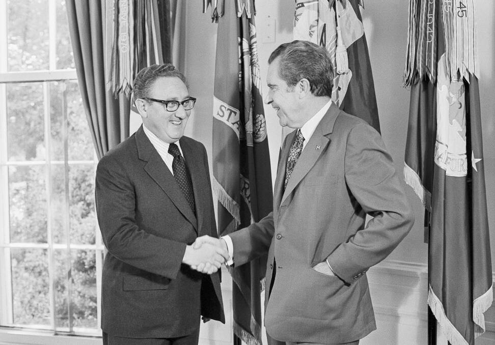 President Richard Nixon, right, offers his congratulations to Secretary of State Henry Kissinger, after the secretary won the 1973 Nobel Peace Prize, in the Oval Office of the White House in Washington on October 16, 1973.Picture via AP Photo/Jim Palmer, File