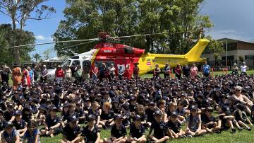 Wauchope Public School students gather around the Westpac Rescue Helicopter on the school's playing ground on Monday, November 27. Picture by WRHS