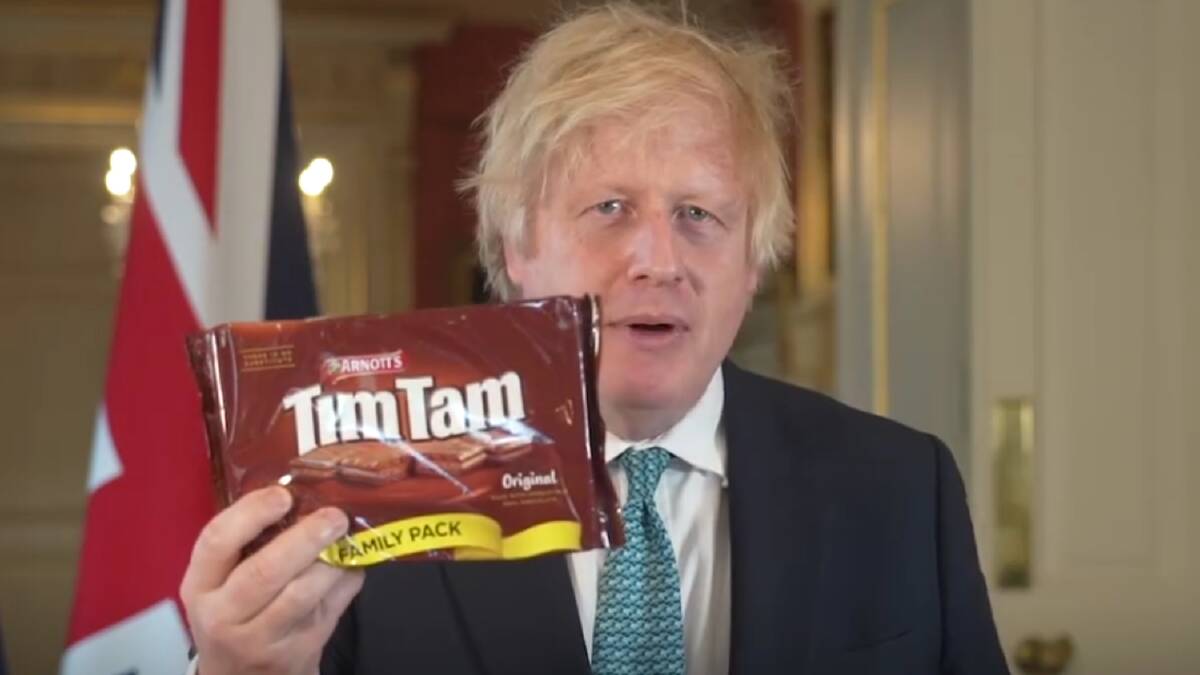 Former UK prime minister Boris Johnson with a packet of Tim Tams as he discussed a free trade deal with Australia in 2020. Picture via Facebook/borisjohnson