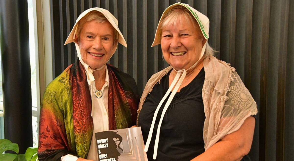 Beryl Walters and Lis Hannelly in colonial dress with new book Rowdy Voices & Quiet Whispers. Pictures by Abi Kirkland
