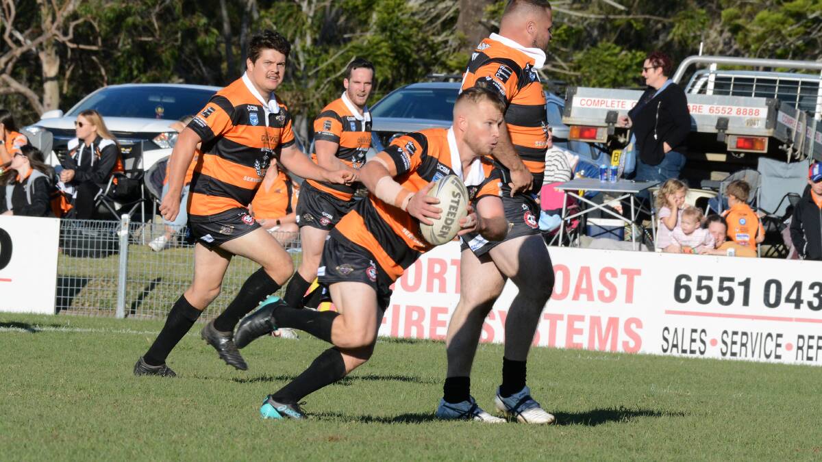 Mitch Collins makes a break from dummy half for Wingham during the 100 year celebration match against Taree City on May 15. Collins will be Wingham's captain-coach next year.