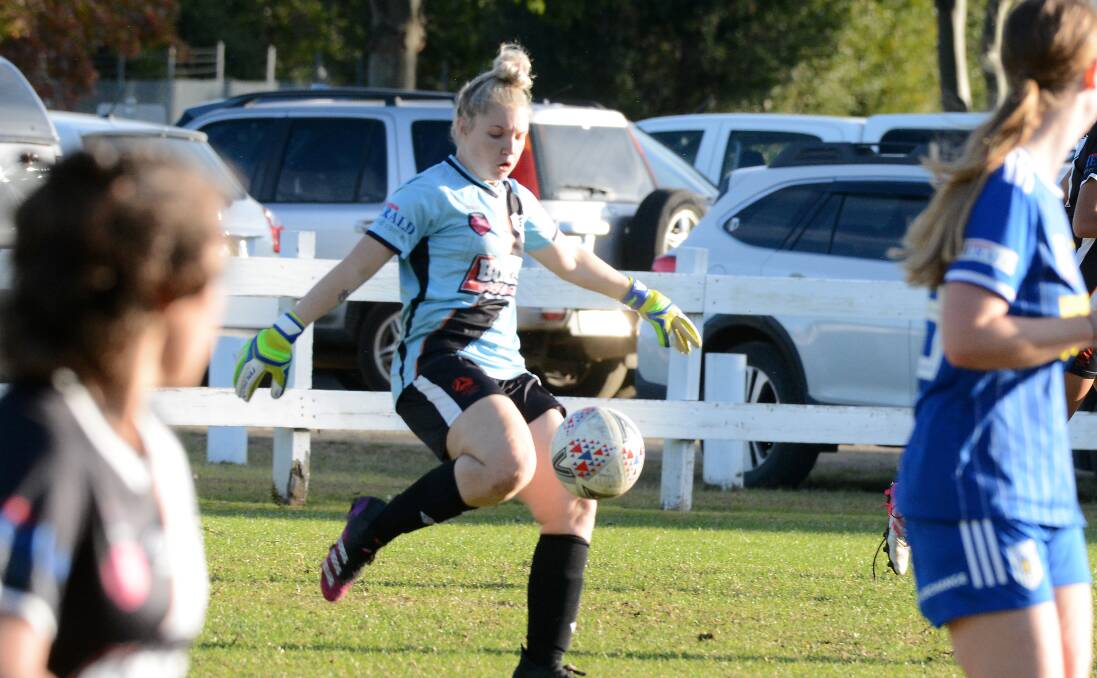 Goal keeper Caitlin Horwood clears the ball for Mid Coast during a match at the Taree Zone Field this year.