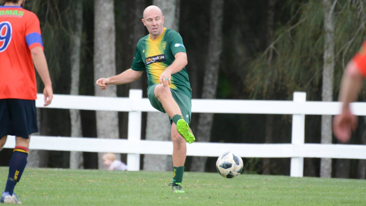 Wingham's Peter Falla playing in last season's Southern League grand final. The Warriors will return to the league this year after the Zone Premier League was canned by Football Mid North Coast.