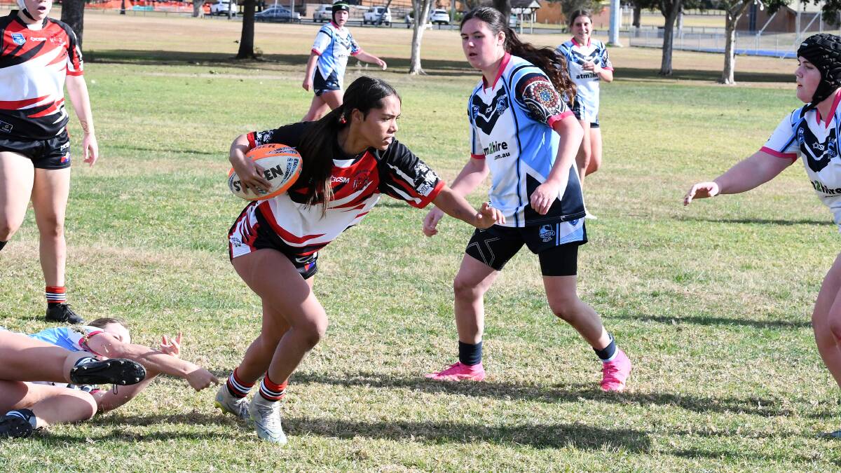 Kaliyah Saunders from Taree Red Rovers makes a break in an under 17 girl's match against Port Macquarie last season.