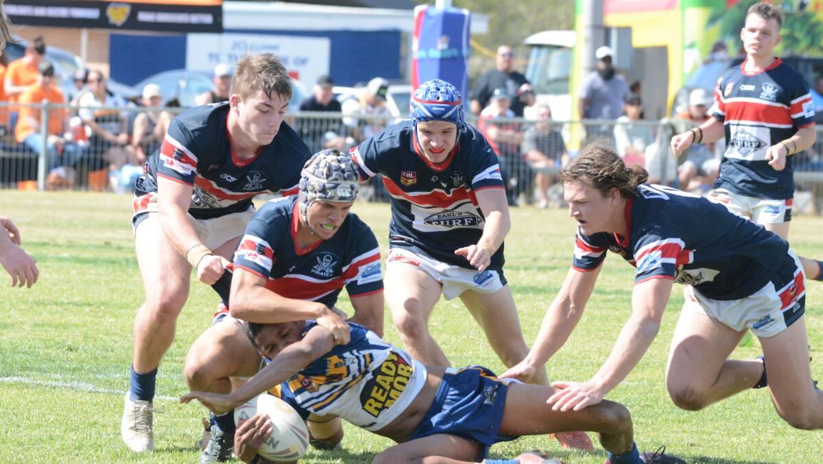 Old Bar defenders swarm on a Macleay player during this year's under 18.5 grand final played on August 25. The 2020 grand finals could be put back to early September.
