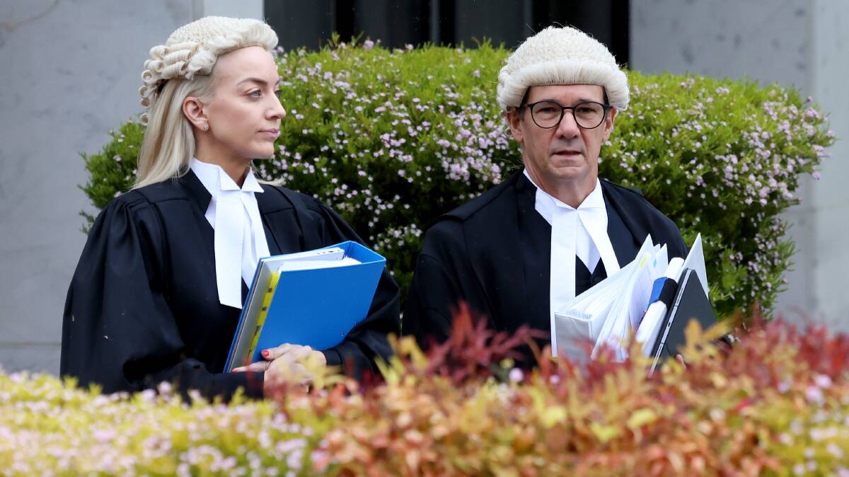 Prosecutors Skye Jerome and Shane Drumgold SC make their way to court on Wednesday. Picture by James Croucher