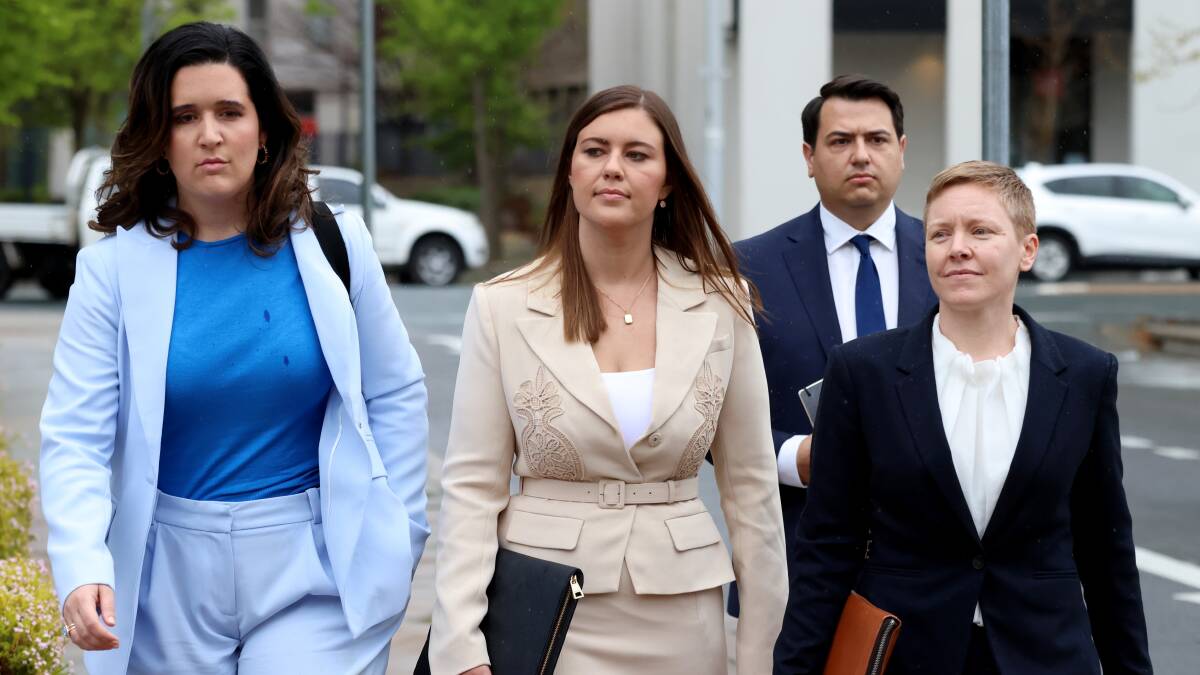 Brittany Higgins, centre, arrives at the ACT Supreme Court on Wednesday. Picture by James Croucher