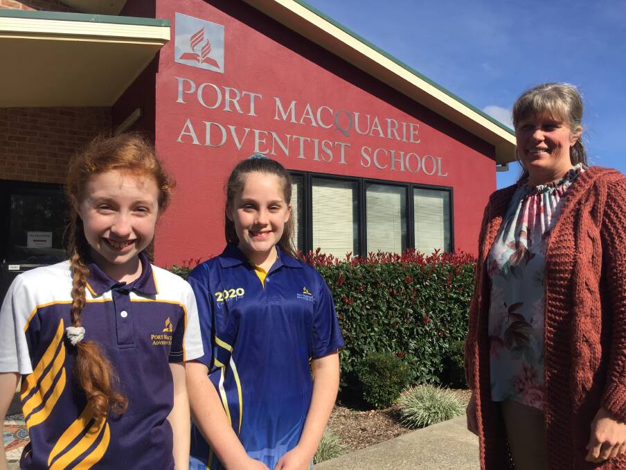 Exciting times: Port Macquarie Adventist School will offer secondary education in 2021. Year 6 students Maya Thompson and Eily Weiss along with principal Joyanne Walsh are celebrating the announcement.