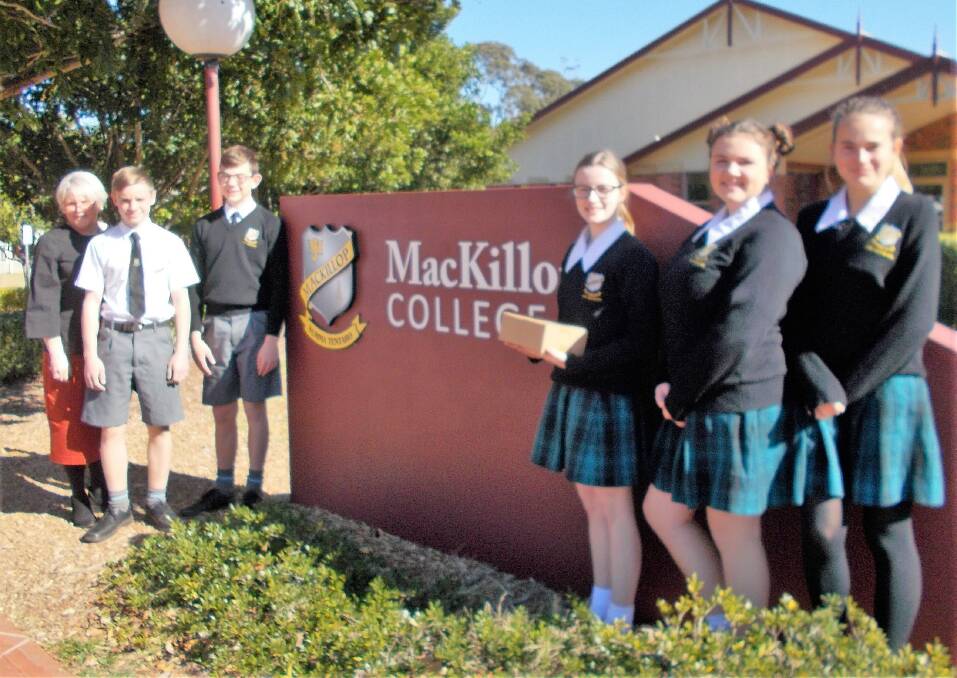 Helping: MacKillop College assistant principal, Jennifer Campbell, with year 9 MacKillop students, Reece Fretten, Samuel Cramer, Mirren Campbell, Jorja Montgomery and Marie Tessede. Photo: supplied