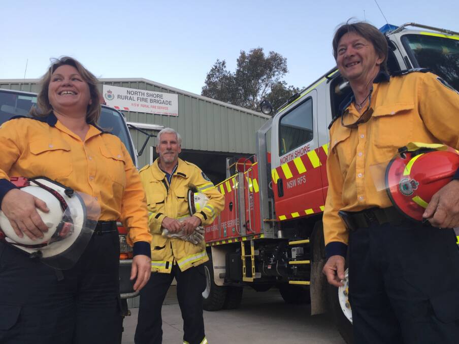 Get ready: North Shore Rural Fire Service brigade's Lisa Hort, Rob Johnston and captain Kingsley Searle invite community members to their Get Ready Weekend barbeque at the Settlement Point ferry on Saturday.