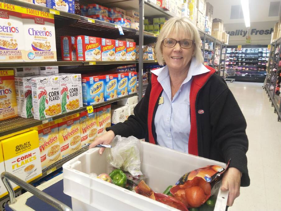 Home deliveries: Julie Hargy filling a home delivery order at the Hastings Co-op's IGA supermarket in Wauchope.