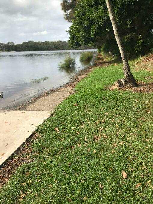 It's over: Water over the footpath at Lake Cathie on Saturday. Photo: Mark Poole.