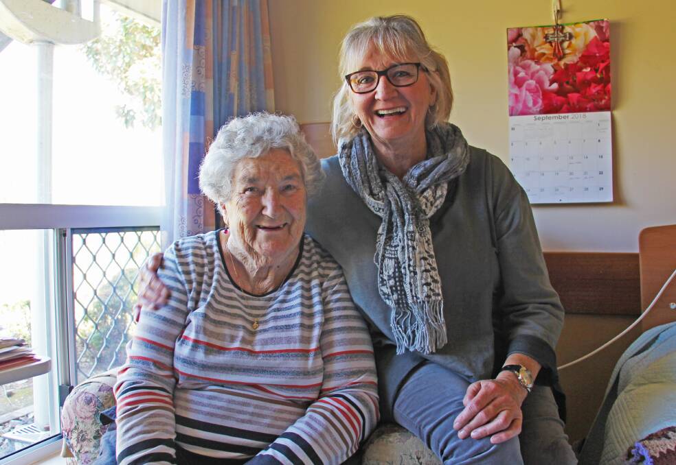 Milestone girl: Celebrating 40 years as an employee of St Agnes' Parish, enrolled nurse Christine Welsh (right) catches up with Emmaus resident, Margaret Howard, whose elderly mum Christine also cared for early in her career.