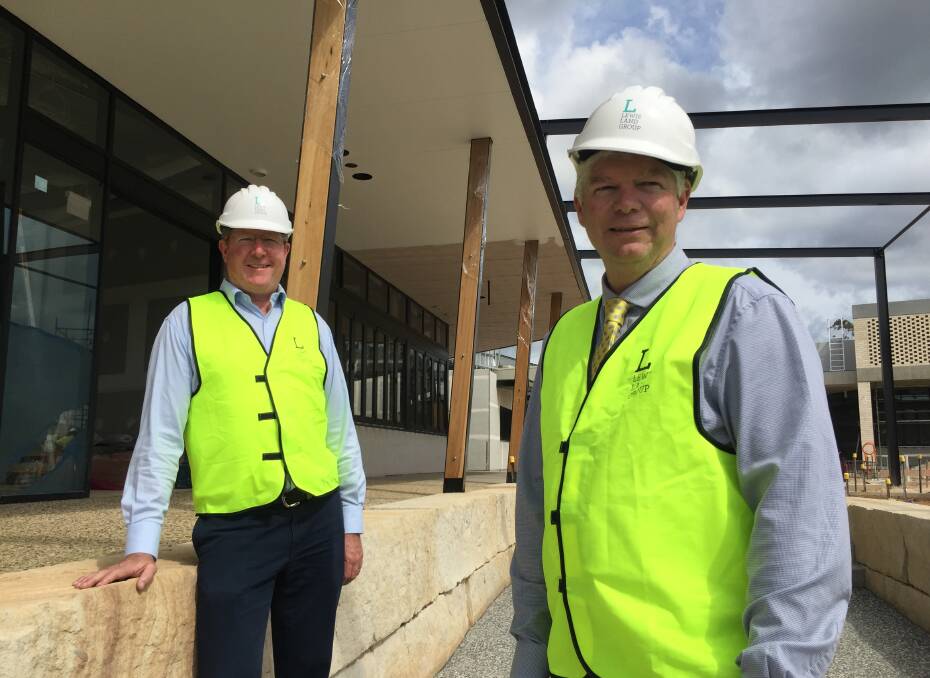 Ready to go: Lewis Land Group's Michael Long and Hastings Co-operative Ltd's Allan Gordon during a tour of the soon-to-open Sovereign Place.