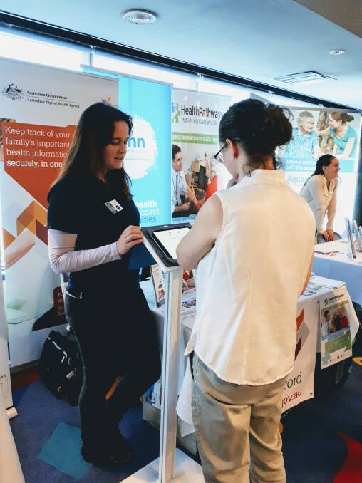 Your choice: Amanda Wilkinson explaining the My Health Record to a resident at a recent health symposium.