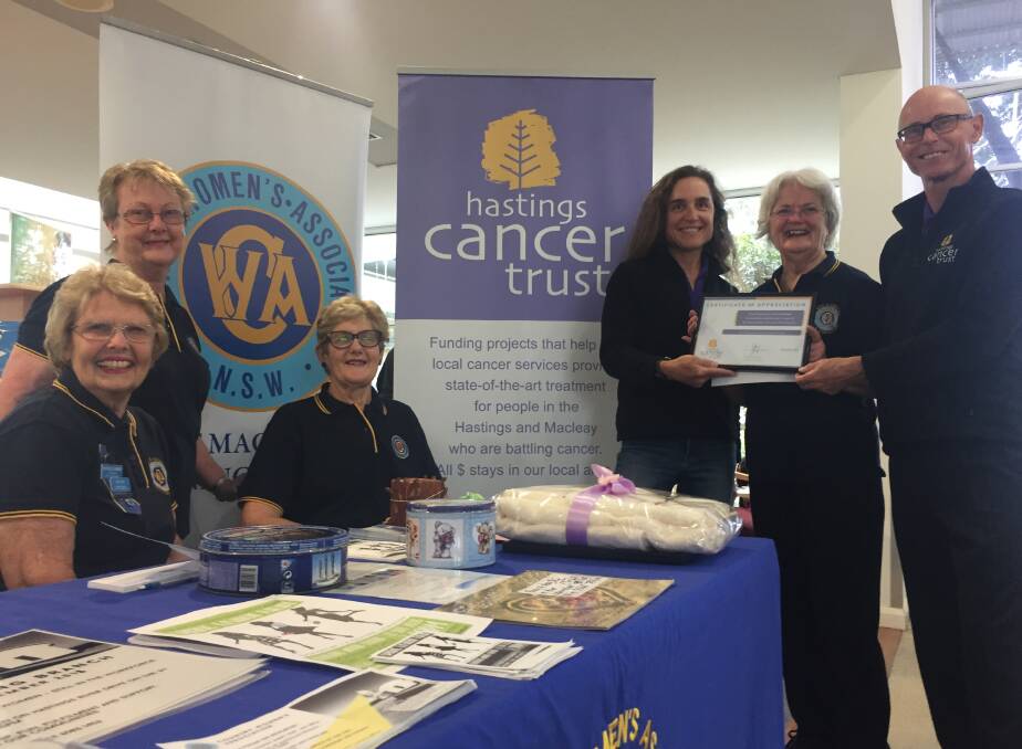 Thank you: Port Macquarie CWA Evening branch members, Fay Bischoff, Lynne Overton and Patricia Godfrey look on as president, Gay Cowan, second from right, presents a cheque to Hastings Cancer Trust fundraising coordinators Hazel Kirby and Stephen Thomas.