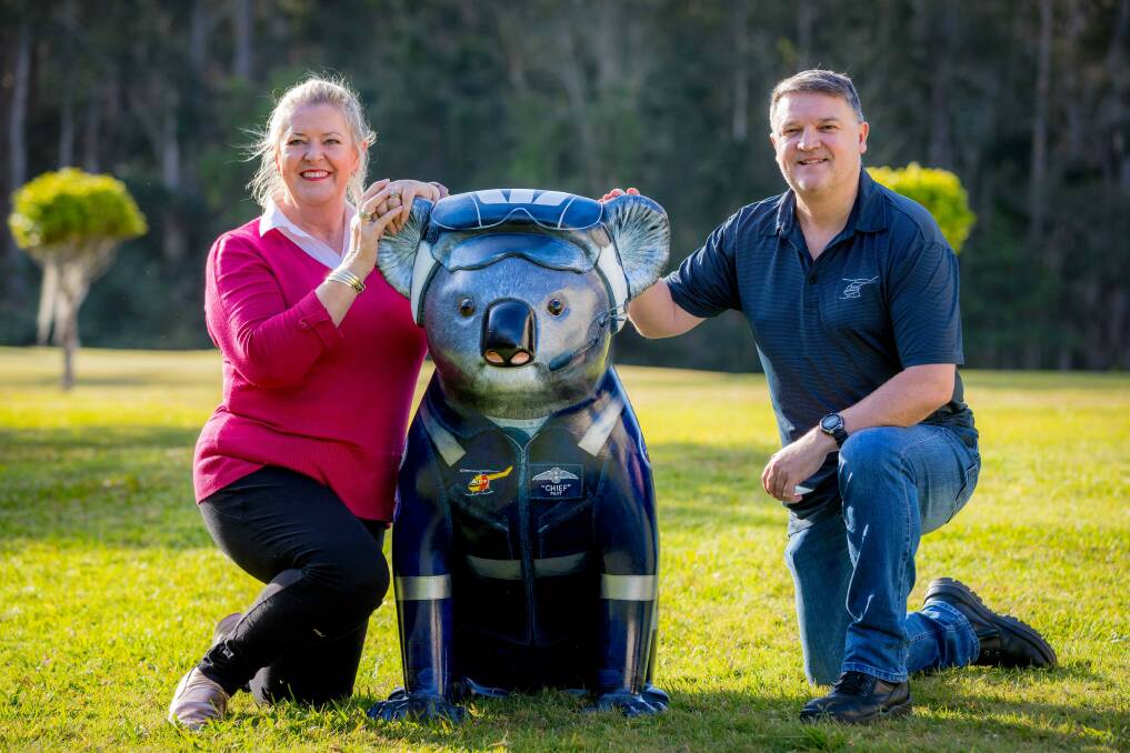 Call the pilot: Artist Pauline Roods and Westpac Rescue Helicopter Service's Richard McGovern with chief, the latest addition to the Hello Koala Sculpture Trail. Photo: Lindsay Moller