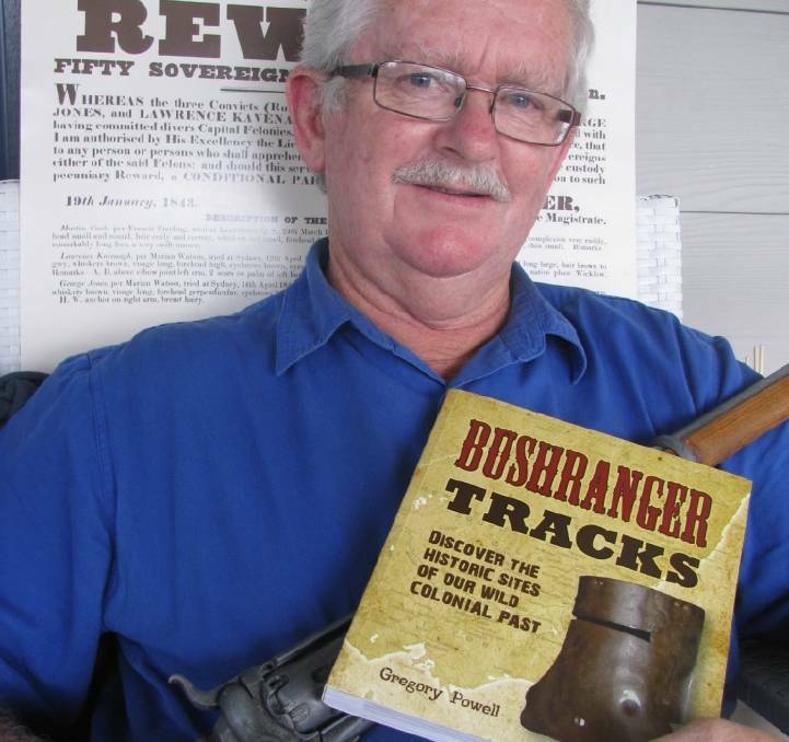 Colonial days: Author Gregory Powell with his book Bushranger Tracks. Photo: Newcastle Morning Herald.
