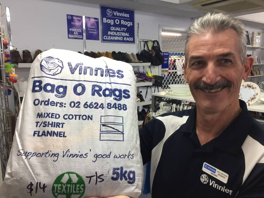 Ultimate recycling: St Vincent de Paul volunteer Geoff Garard with a Bag O Rags available from the Gordon Street shop. Photo: Peter Daniels