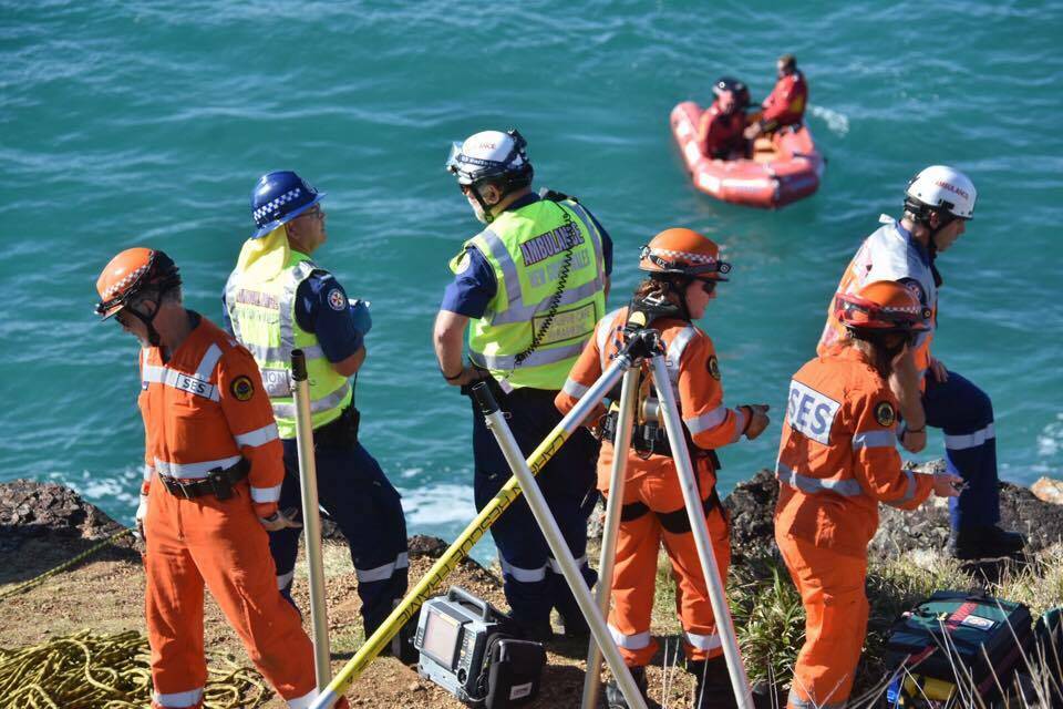 Emergency services preparing to winch the injured rock fisherman to safety.